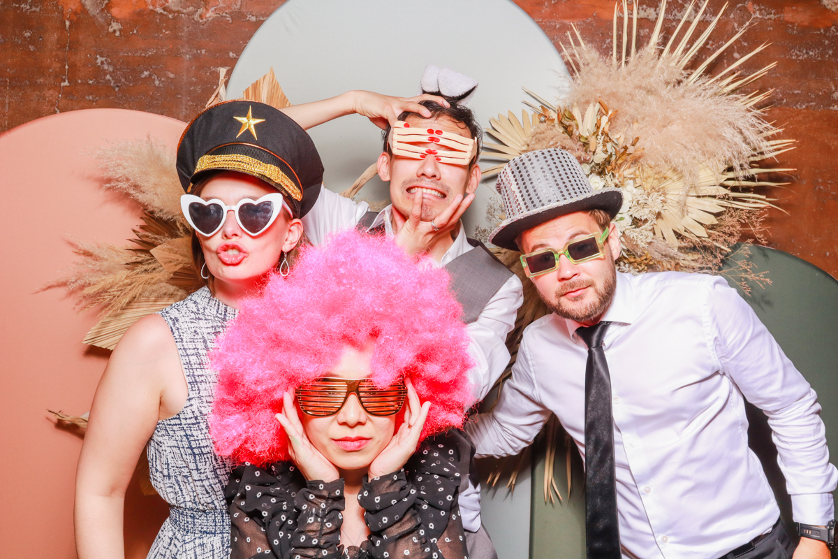 4 guests posing for a modern photo booth for memorable wedding parties during a gloucestershire party entertainment 