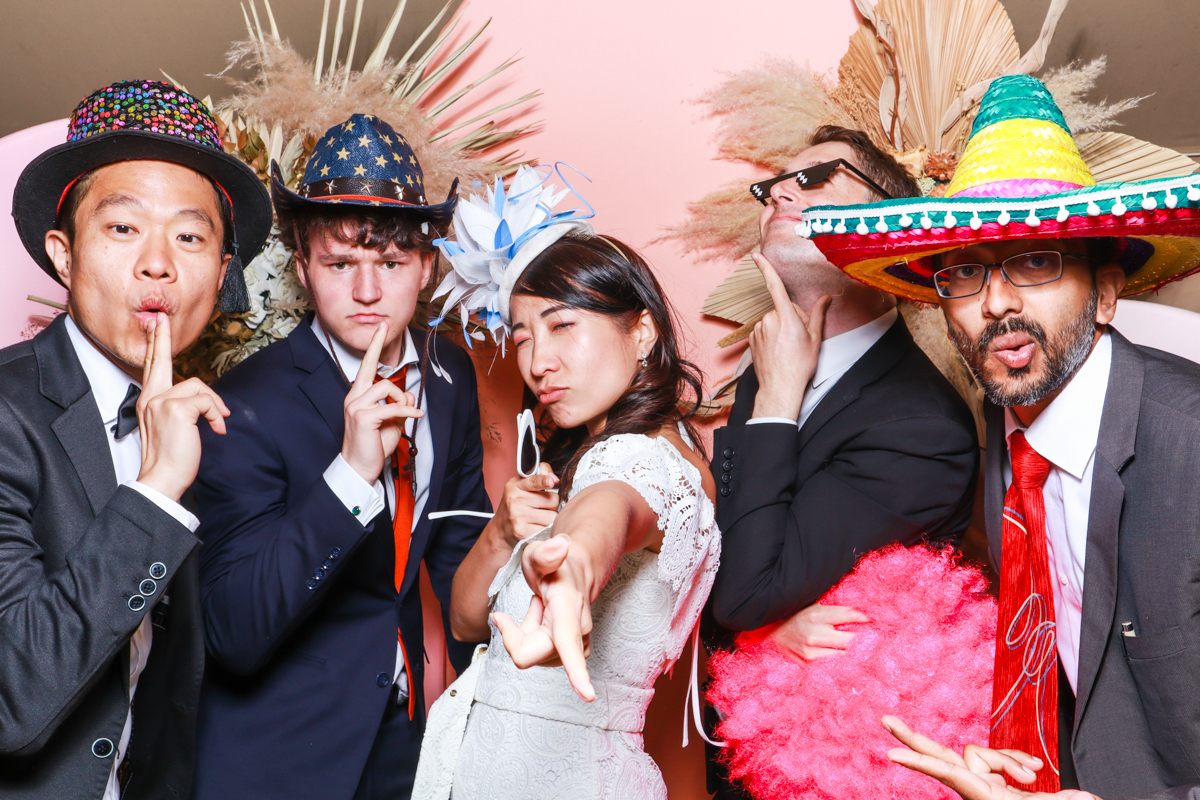 guests using the photo booth during an euridge manor wedding