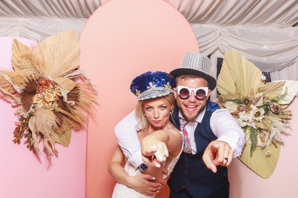 couple using the photo booth for an ebrington manor