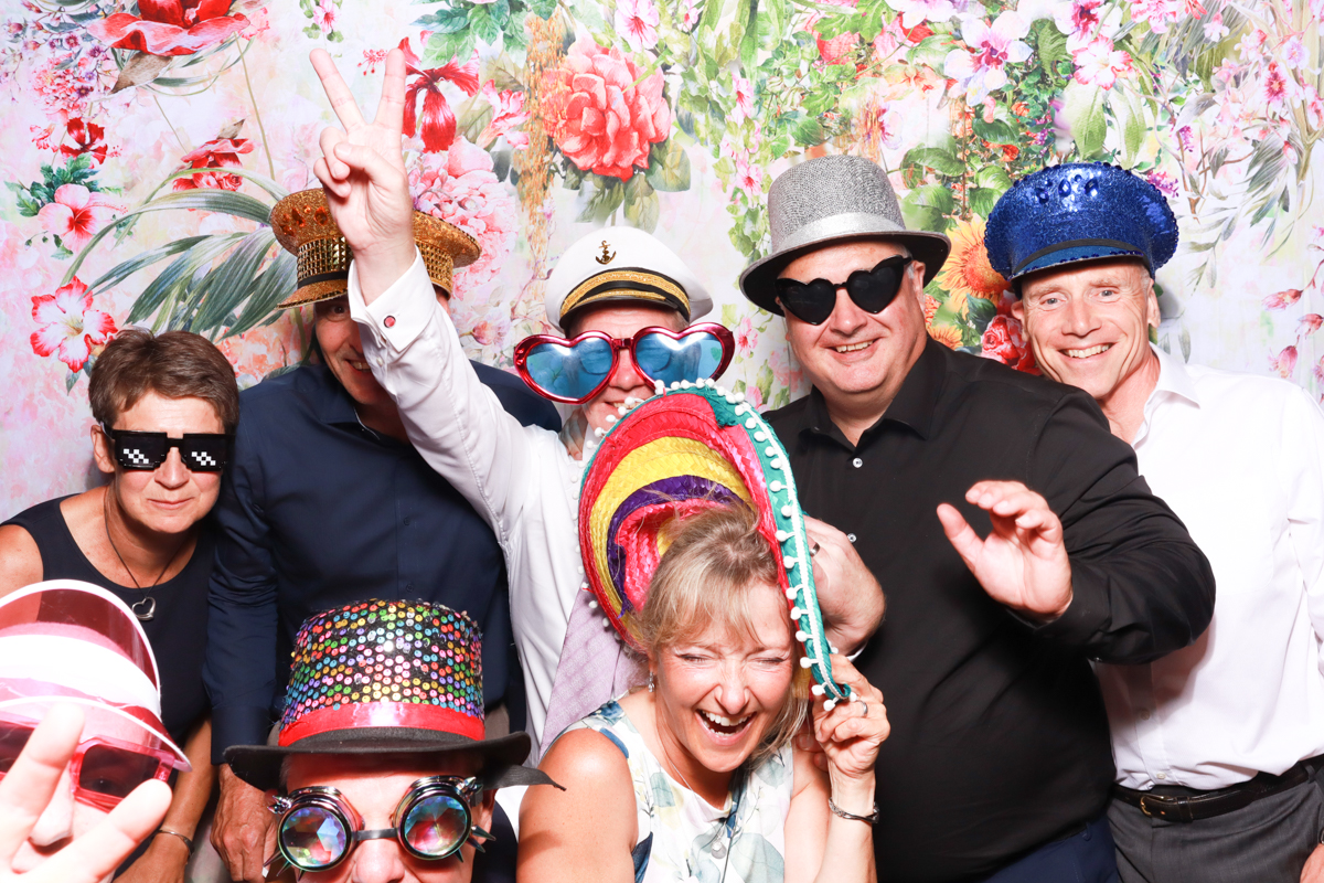 guests having fun with a photo booth during the wedding entertainment for the reception