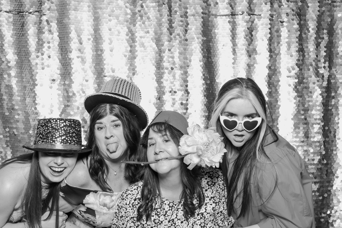wedding guests posing for mad hat photobooth during an Old Gore Wedding