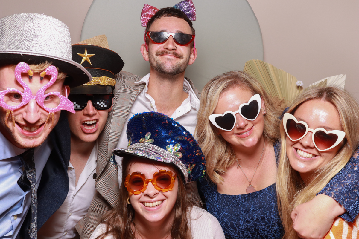 group of guests during a wedding reception for the barn at upcote photo booth