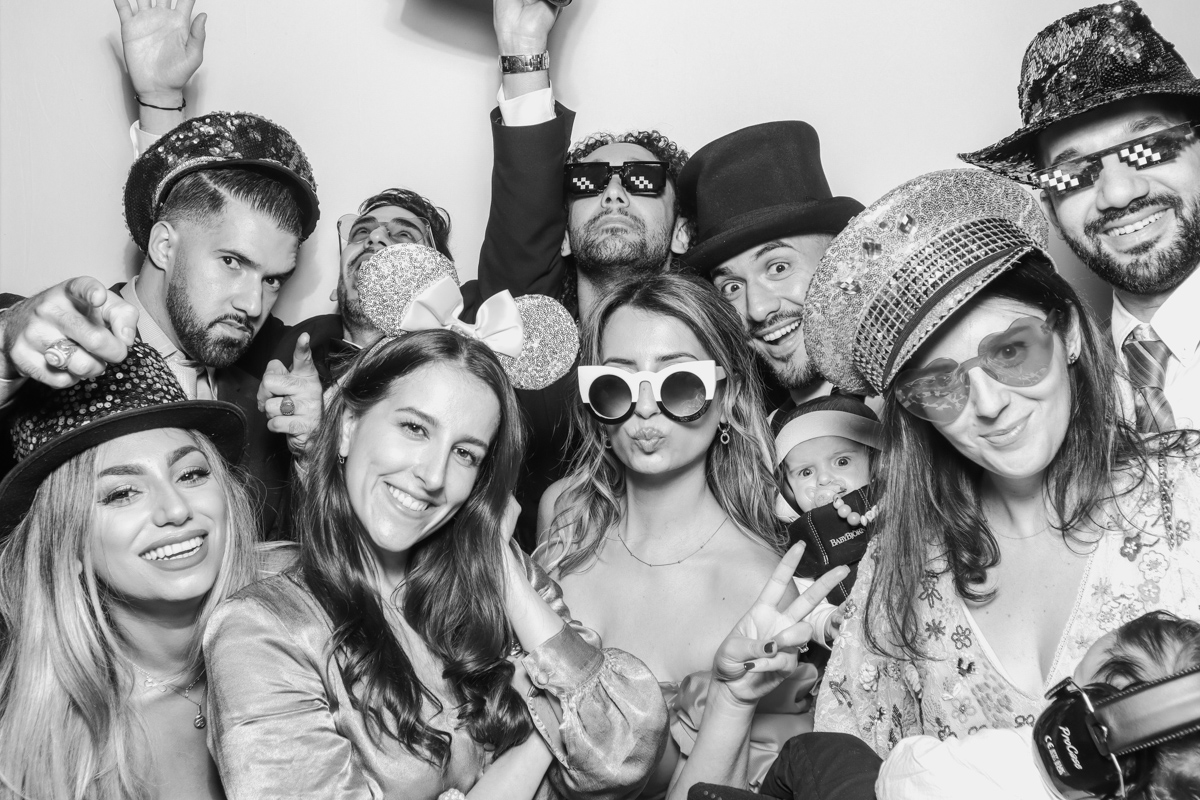 Large Group PHoto for a black and white print during the party entertainment at Stone Barn