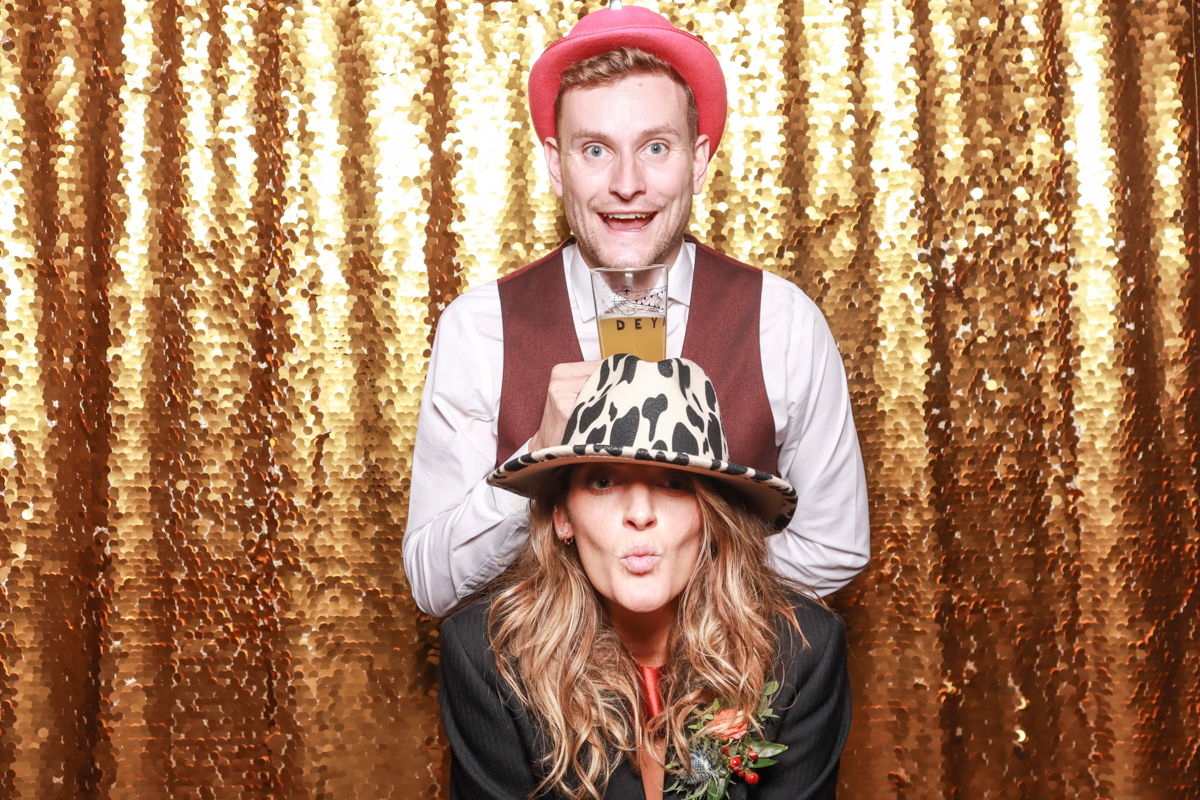 fun cripps barn photos for a photo booth rental with sequins backdrop