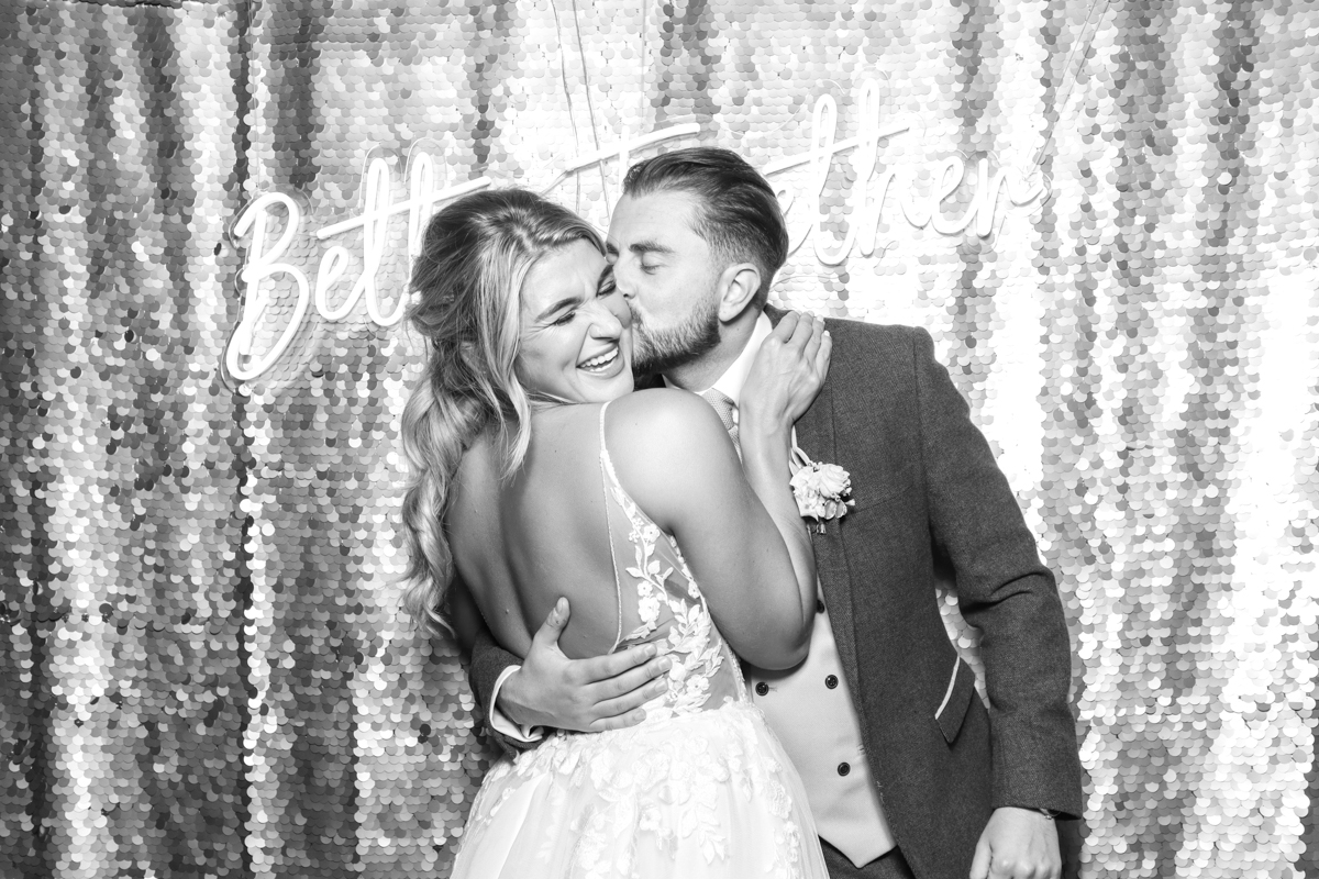 bride and groom using the photo booth for their cotswolds wedding