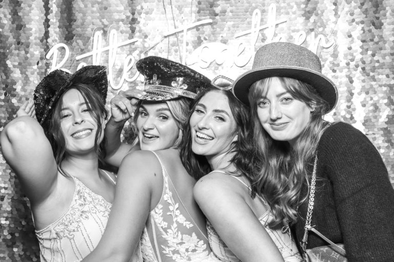 guests posing for a photo booth hire at shustoke barn