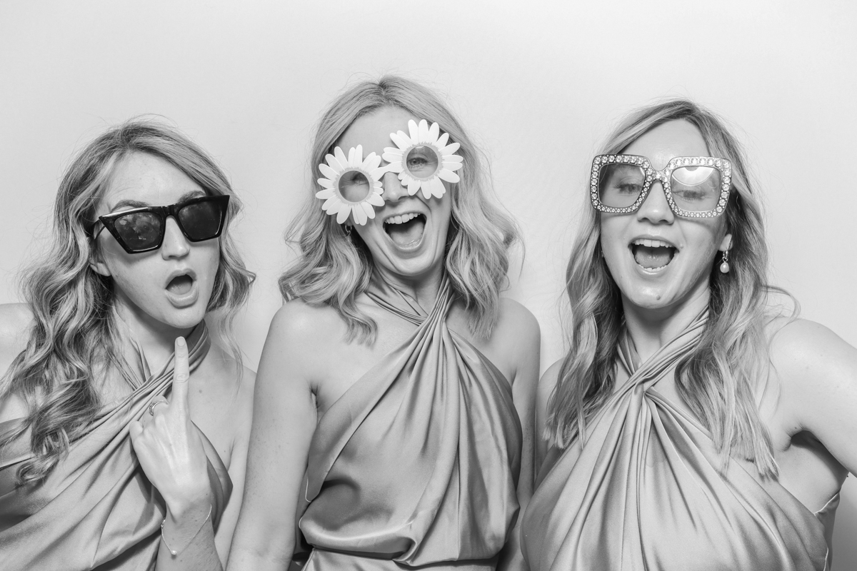 bridesmaids posing for a black and white vintage photo booth hire cotswolds