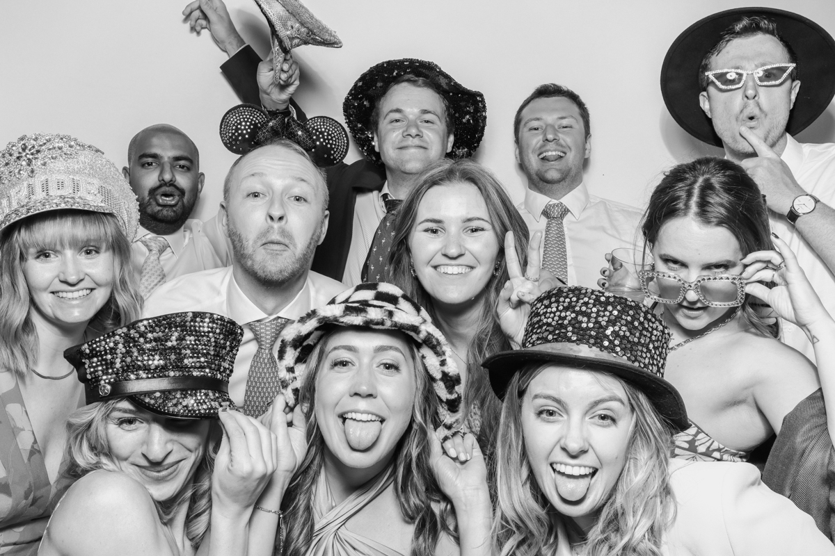 large group of people posing for a fun photo booth hire in cotswolds