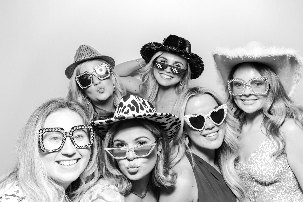 group of guests posing for a b&w photo booth hire Cotswolds