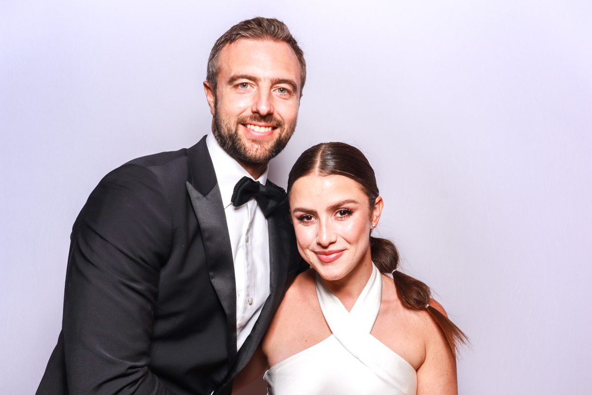 stylish photo booth with a plain white backdrop