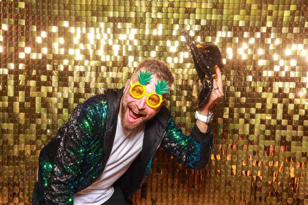 gold shimmer wall for a food festival in the Cotswolds area, with mad hat photo booth hire