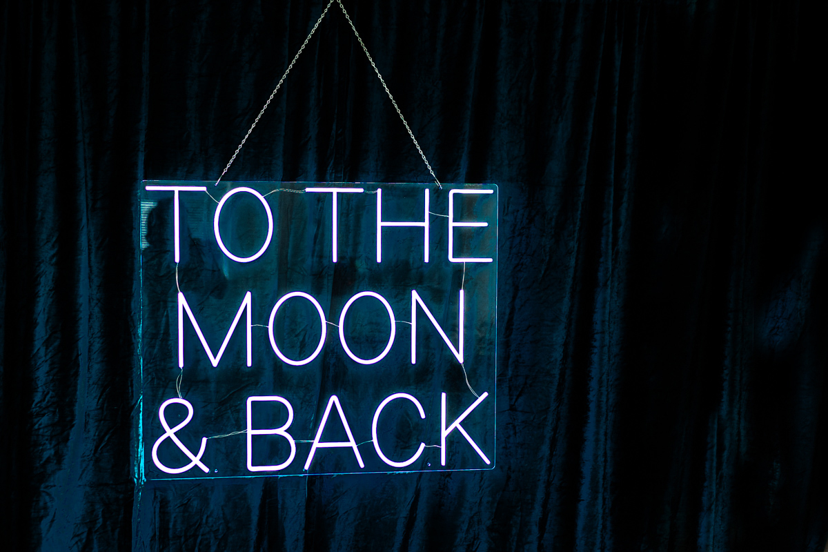 To the Moon and back neon sign for hire Cotswolds, perfect for a ceremony backdrop or a photo booth setup
