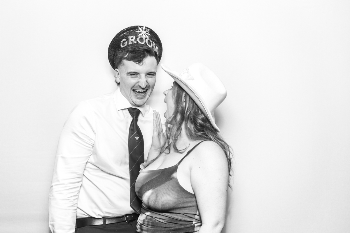 couple having fun during a wedding photo booth party entertainment in the evening, with a kardashian style photo booth hire