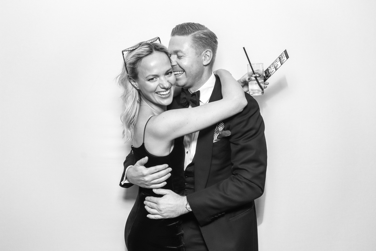 fun photo booth hire cotswolds with black and white strips during the wedding party