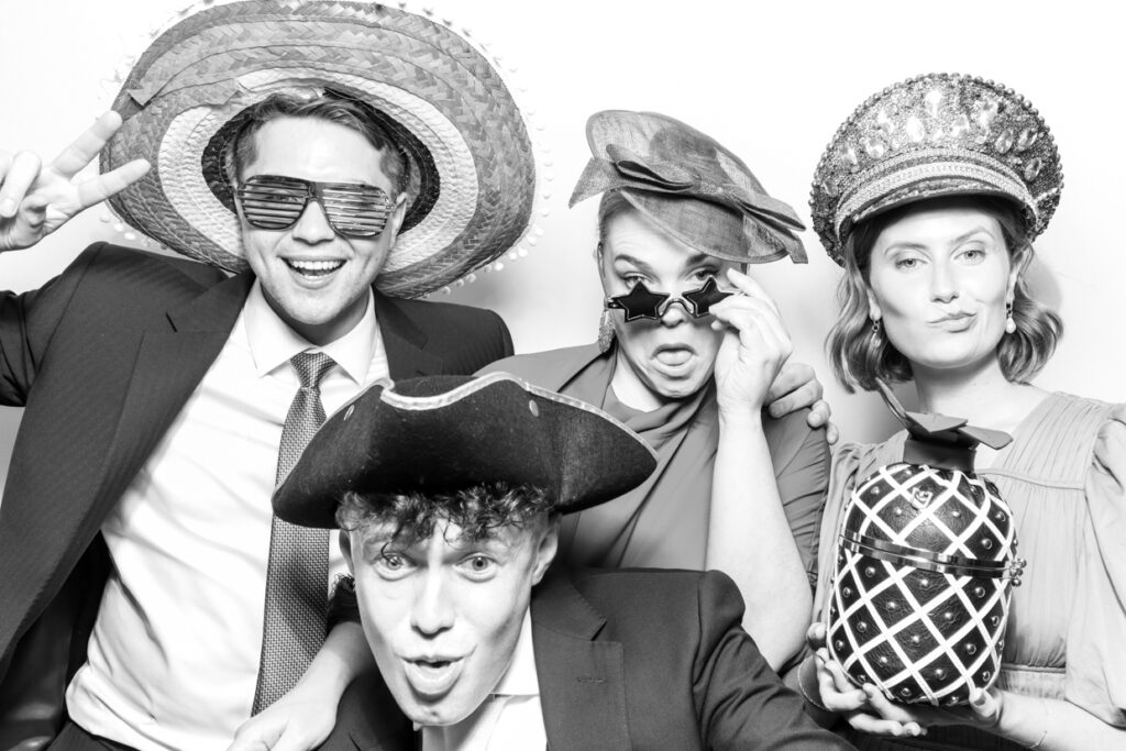 4 guests during a Photo Booth Hire in Leicester  for a wedding party entertainment with a b&w  kardashian filter