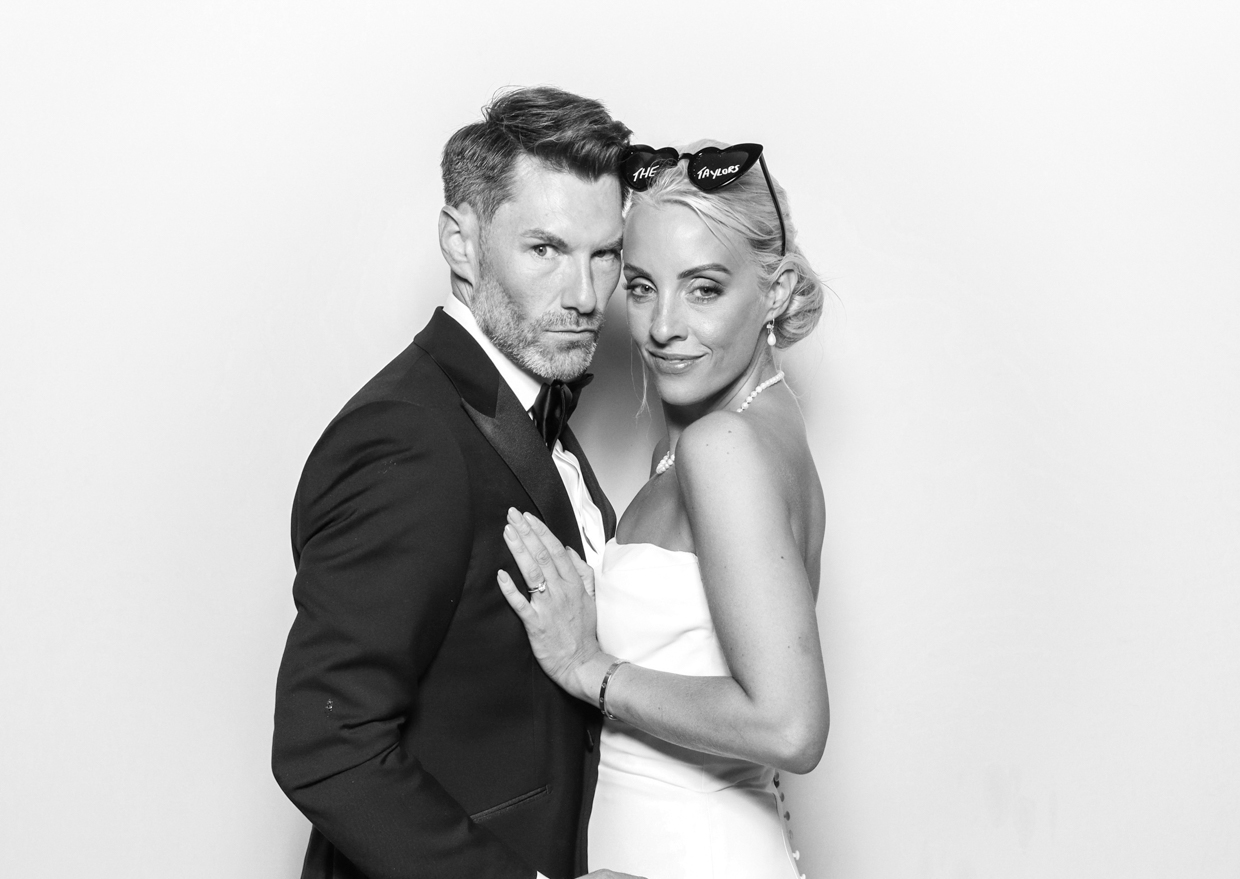 elegant couple posing during a luxury photo booth rentals event entertainment