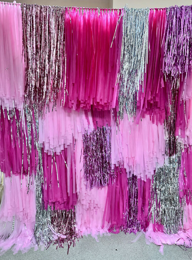 pink and silver Fringe Wall Backdrop on Etsy for a selfie station diy photo booth station