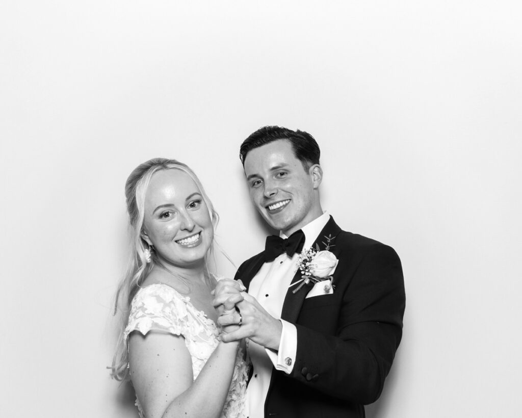 b&w photo of bride and groom posing and having fun at the The Great Barn Aynho Wedding Photo Booth with  mad hat photo booth rental Banbury, Oxfordshire