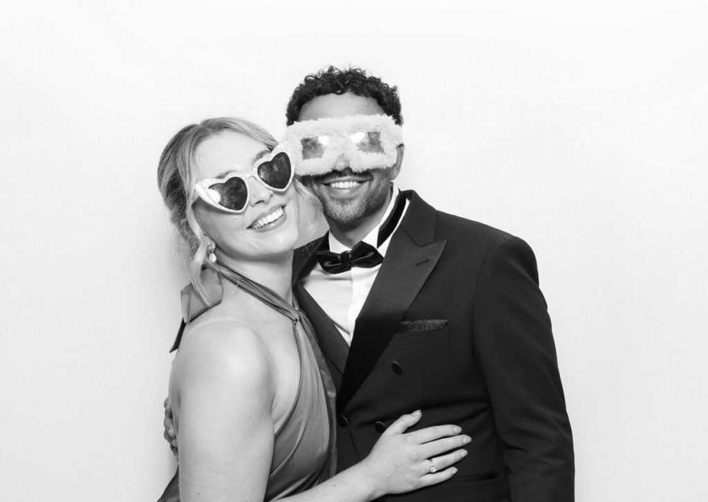 kin house wedding photo booth rental with couple posing for mad hat photo booth 