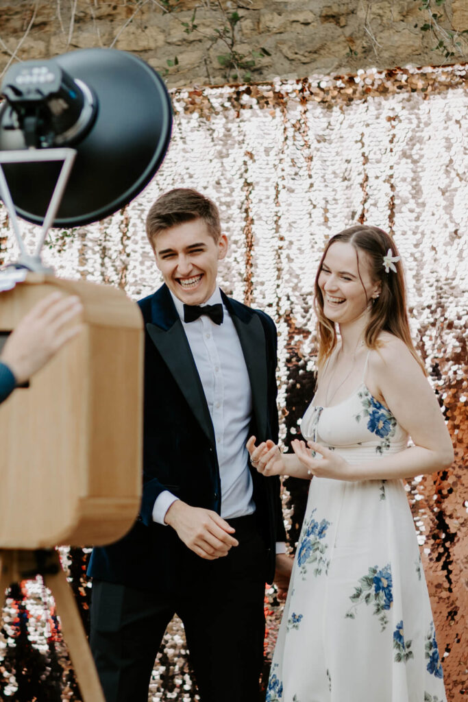 2 guests posing for a luxury photo booth hire during a corporate party entertainment in the cotswolds 