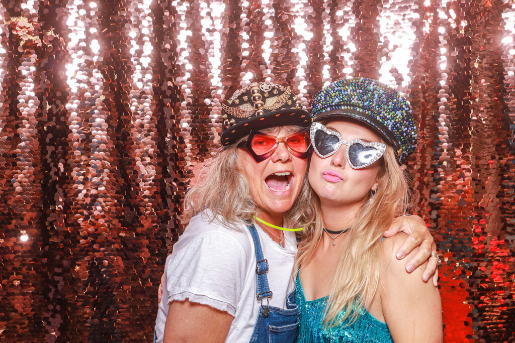 2 guests posing during a fun themed birthday party photo booth entertainment in the Cotswolds, Oxfordshire, Gloucestershire
