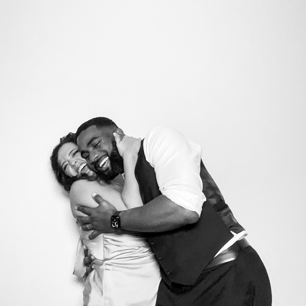 2 guests posing for an affordable photo booth hire