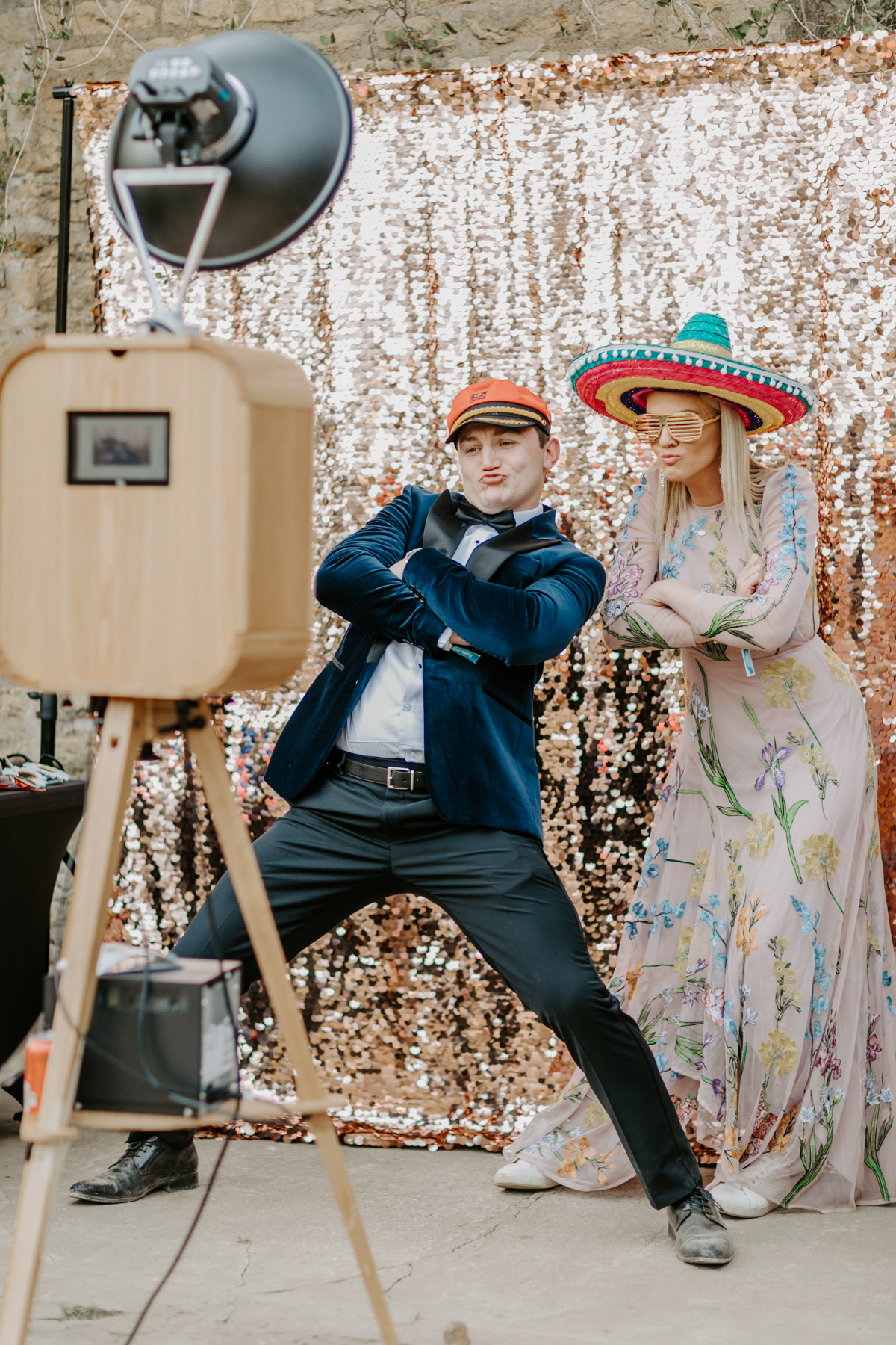 open photo booth style with a sequins backdrop