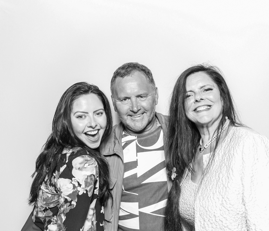b&w kardashian style photo booth with 3 guests posing against a white backdrop, during a wedding party entertainment for armada house photo booth rental