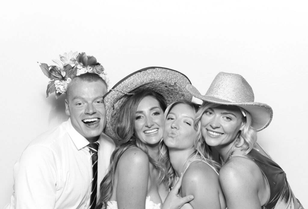 4 guests posing for the ivy lodge photo booth hire cotswolds
