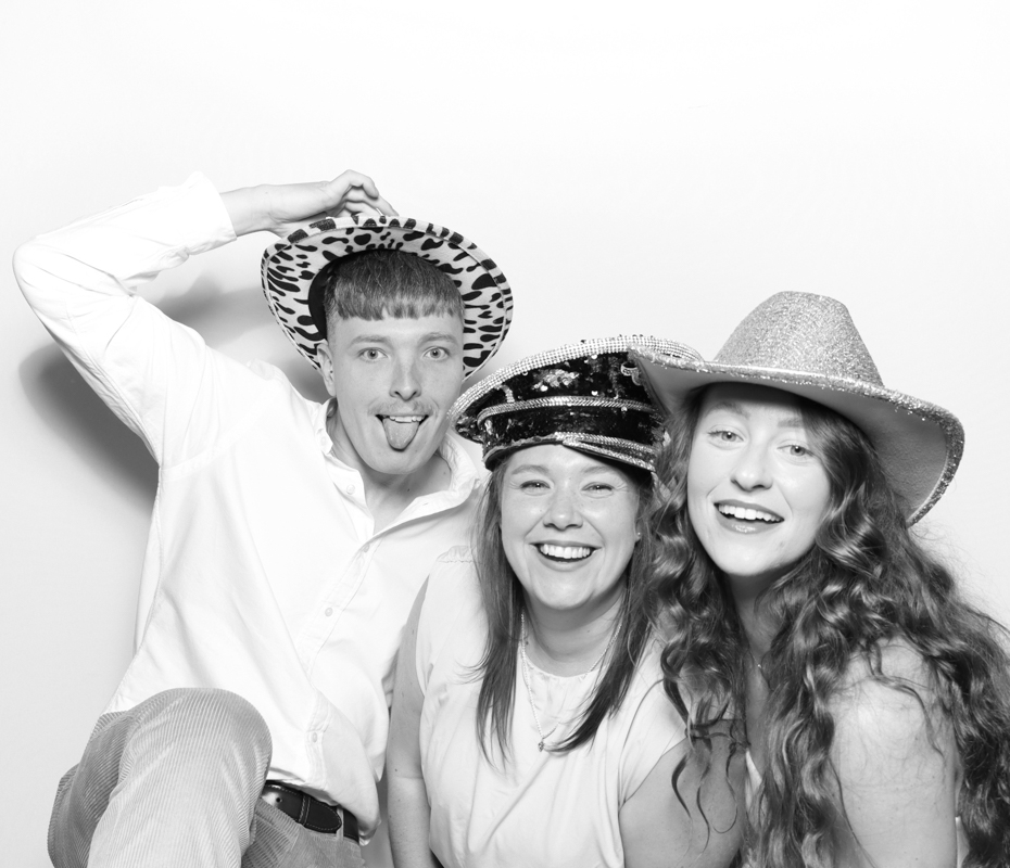 B&W image of 3 guests posing for a premium party entertainment in Cirencester, cotswolds
