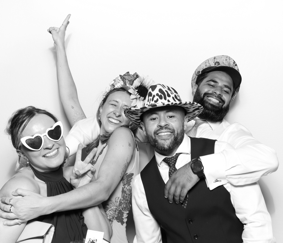 B&W image of guests posing for a premium photo booth rental for the best booth in the Cotswolds
