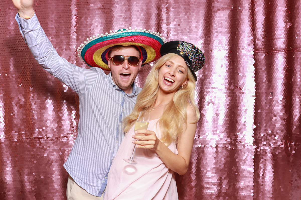 2 guests with fun props during a wedding reception photo booth rental in Worcestershire
