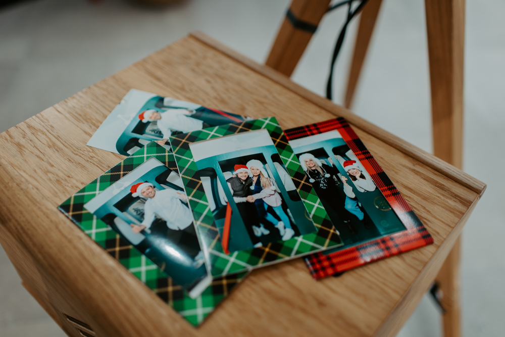 Close up of printed photos from apres ski Christmas photo booth activation at Cotswolds Designer Outlet