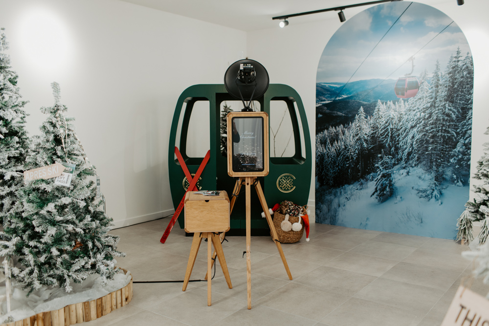 Open air wooden photo booth in an apres ski set at Cotswolds Designer Outlet Christmas shopping centre photobooth