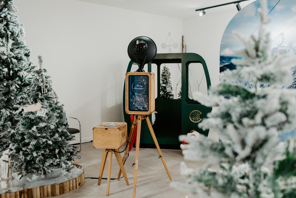 Mad Hat Photo Booth apres ski activation at Cotswolds Designer Outlet with alpine backdrop and alpine decor with ski