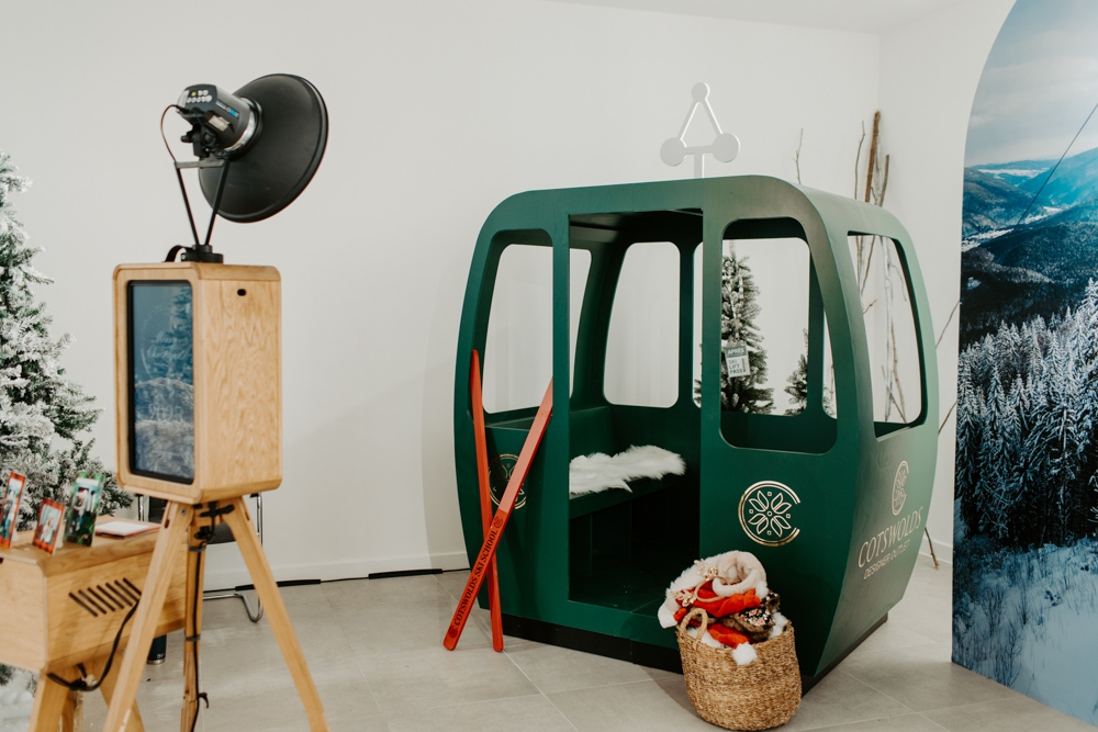 Detail of skis, lanterns and alpine props around apres ski photo booth at Cotswolds Designer Outlet for a Christmas shopping centre photobooth activation
