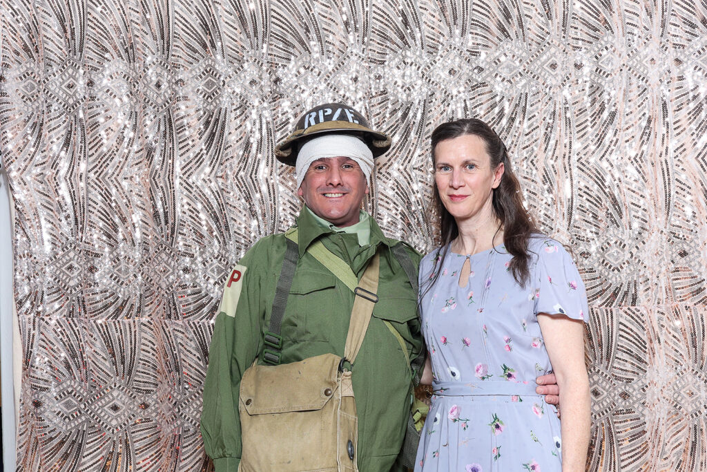 couple dressed up in a 1940s theme with mad hat photo booth during a cotswolds 40th party entertainment