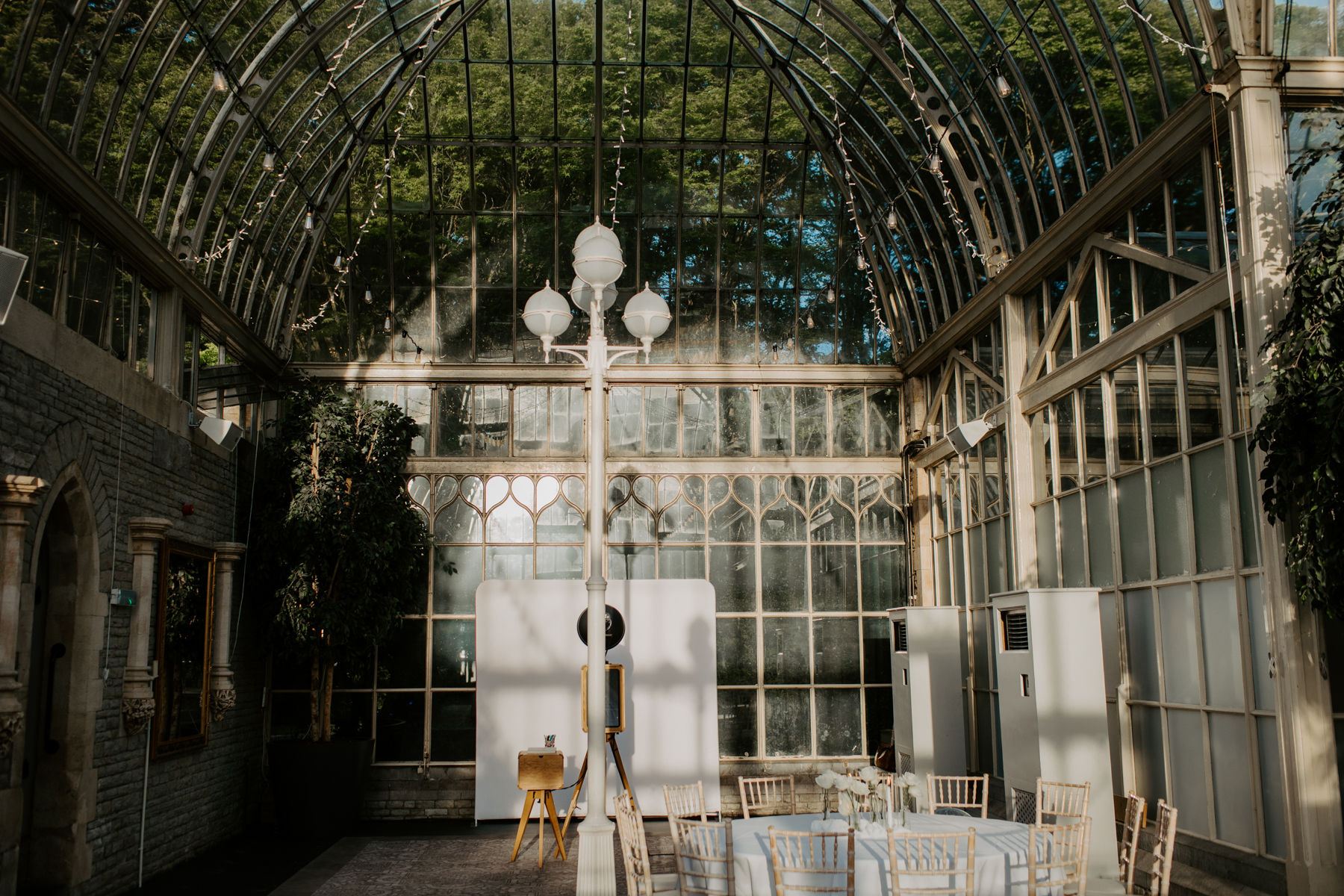 wooden photo booth setup with flash in the orangery at De Vere Tortworth Court party