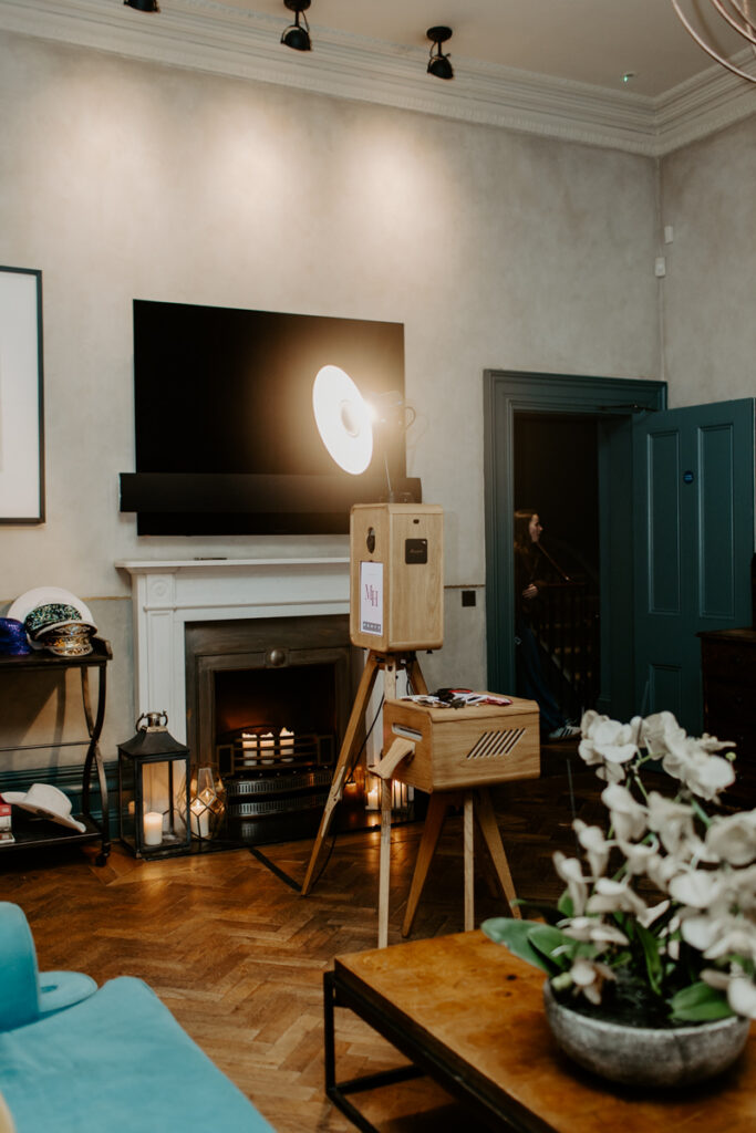 beautiful wooden photo booth setup with the icon, a premium photo booth hire in cheltenham for an 18th birthday party at no131

