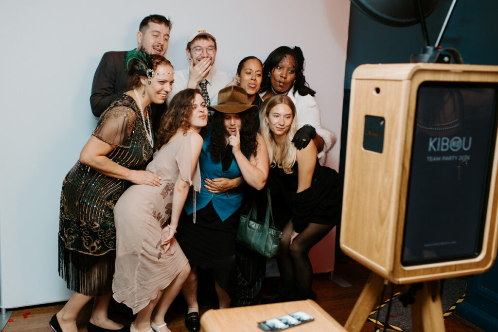 guests posing during an Oxford Town Hall event entertainment for Corporate Events with the icon premium photo booth hire for Kibou restaurant team party 
