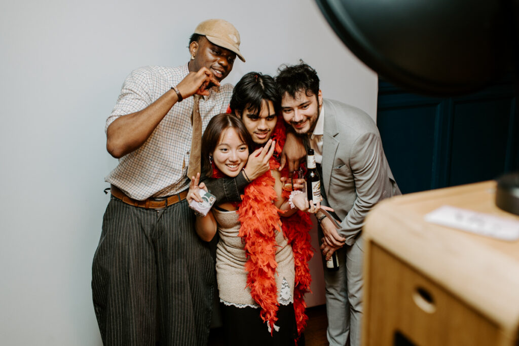guests posing during an Oxford Town Hall event entertainment for Corporate Events with the icon premium photo booth hire for Kibou restaurant team party 
